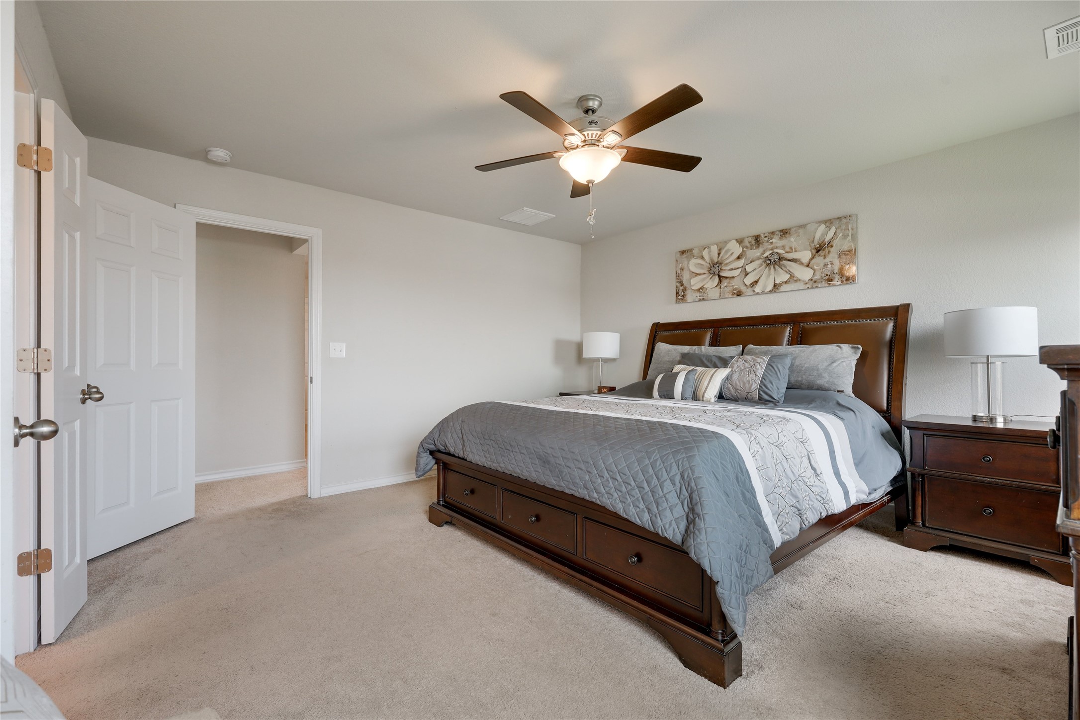 7404 Albany Drive Austin, TX 78754 - Photo 19 of 40 The primary suite offers ample space for a king sized bed, side tables, a dresser and more.