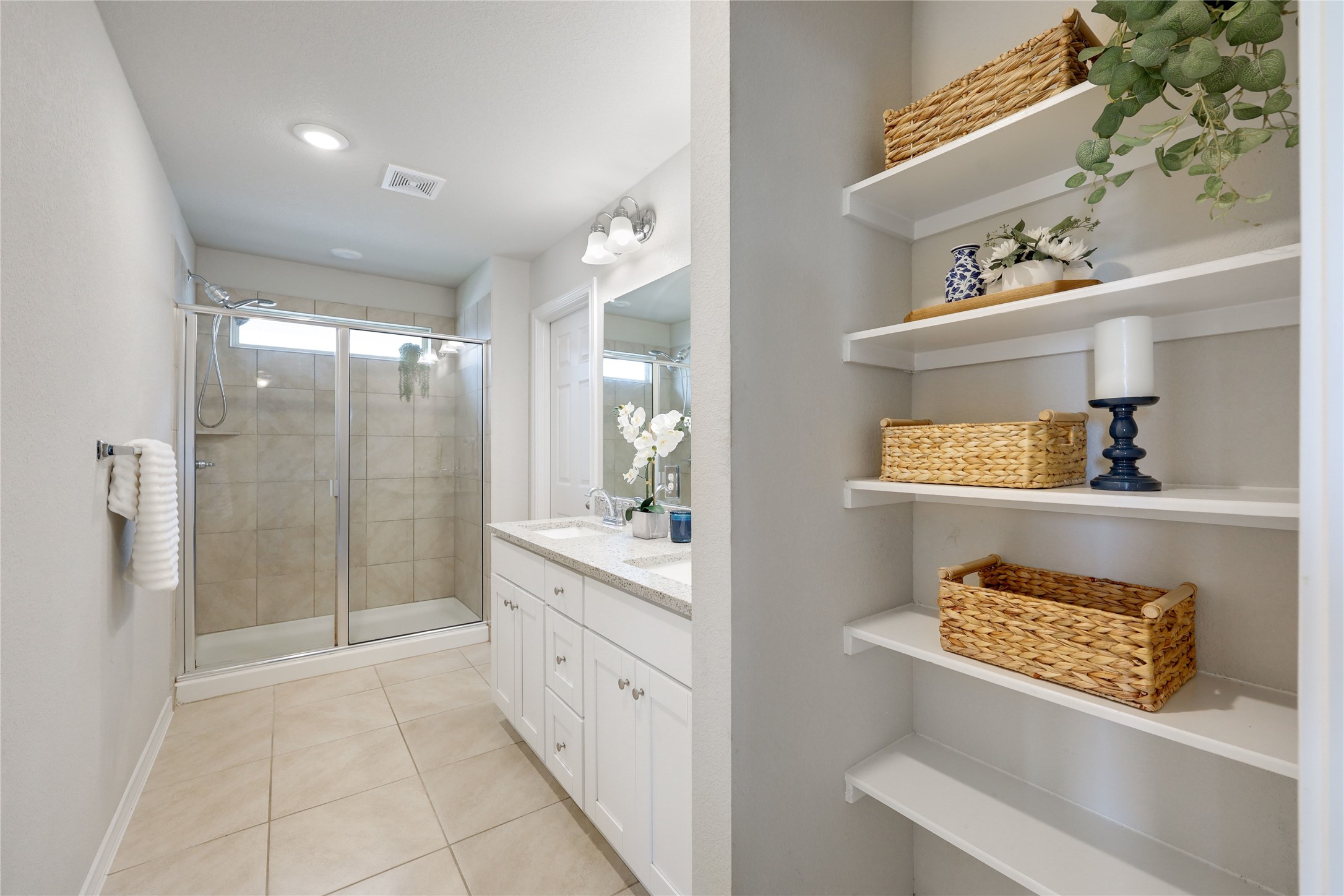 7404 Albany Drive Austin, TX 78754 - Photo 20 of 40 Enjoy your own private ensuite bath complete with a walk-in shower and open linen storage.