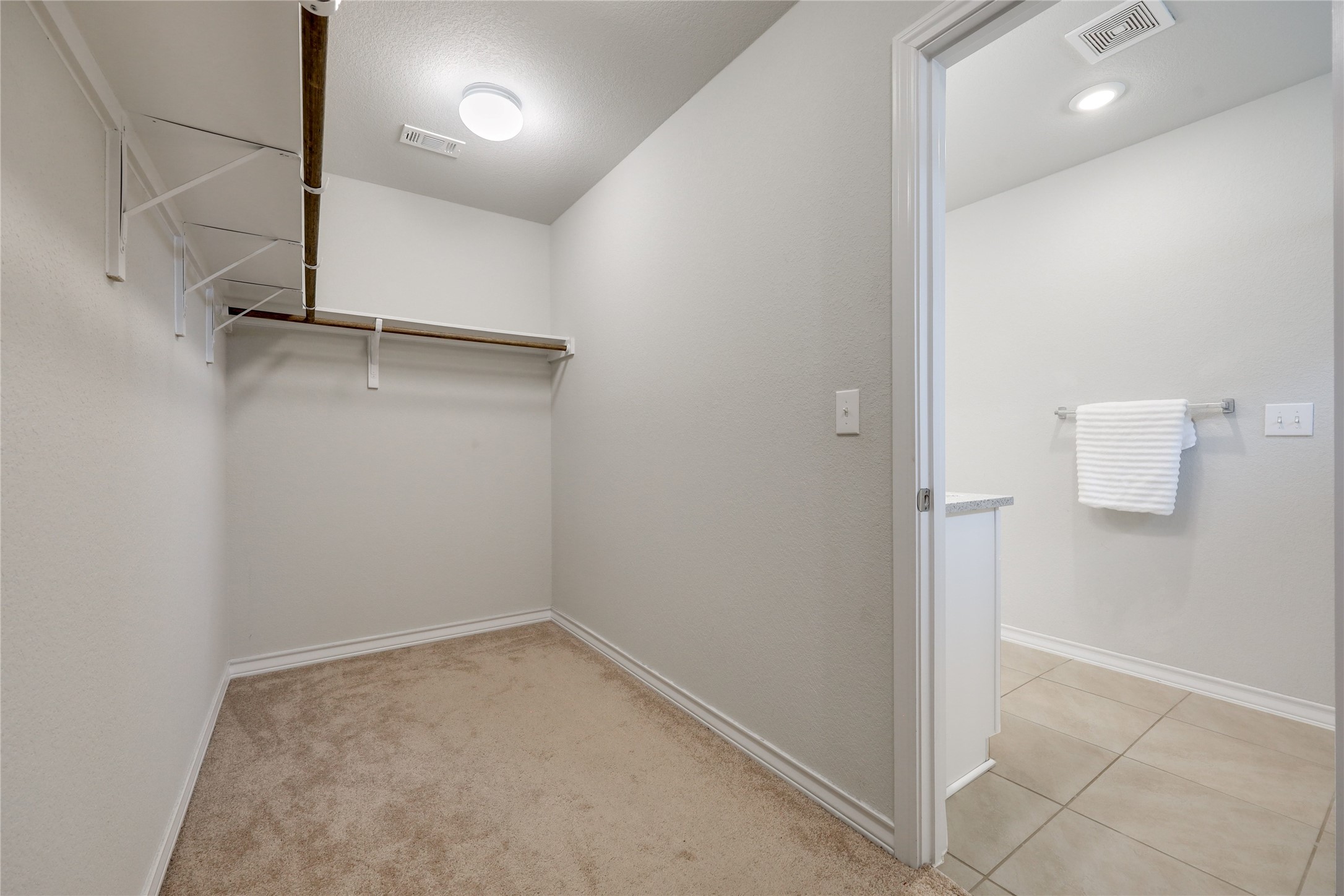 7404 Albany Drive Austin, TX 78754 - Photo 22 of 40 The spacious primary walk-in closet.