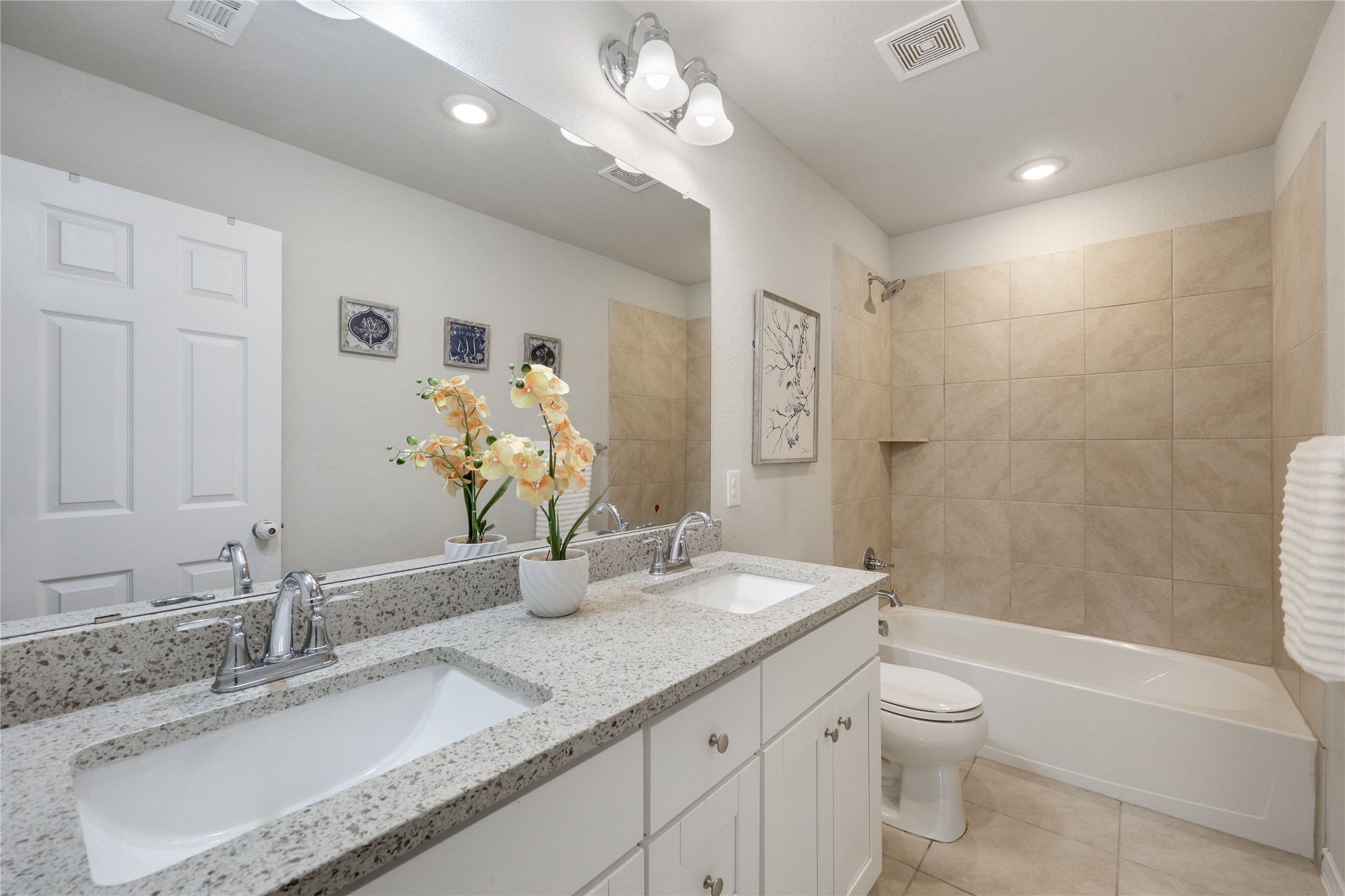 7404 Albany Drive Austin, TX 78754 - Photo 29 of 40 The full secondary bathroom comes with a granite topped dual vanity and shower/tub combo.