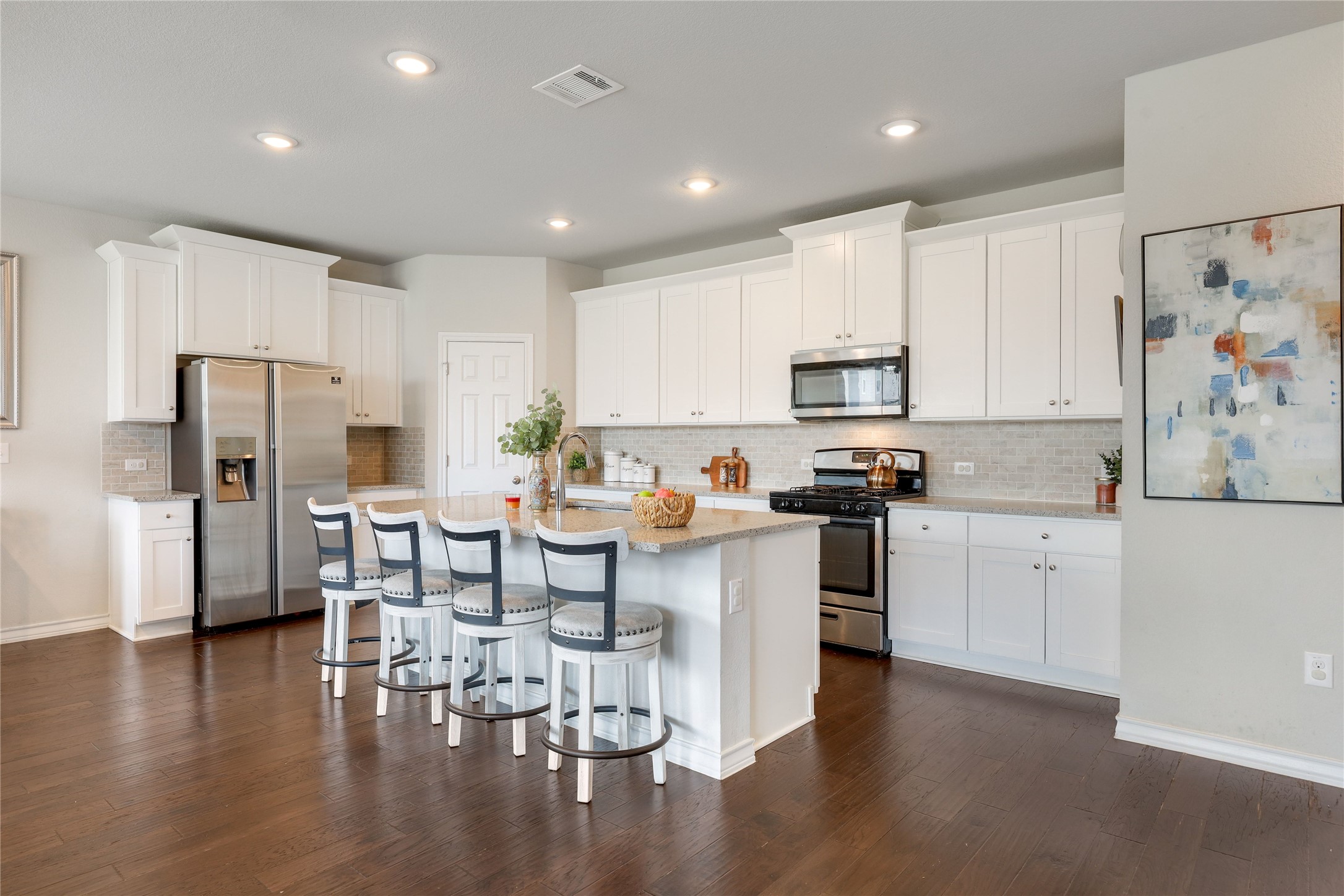 7404 Albany Drive Austin, TX 78754 - Photo 2 of 40 The kitchen comes ready to use with desirable contemporary finishes and an entertainer's island.