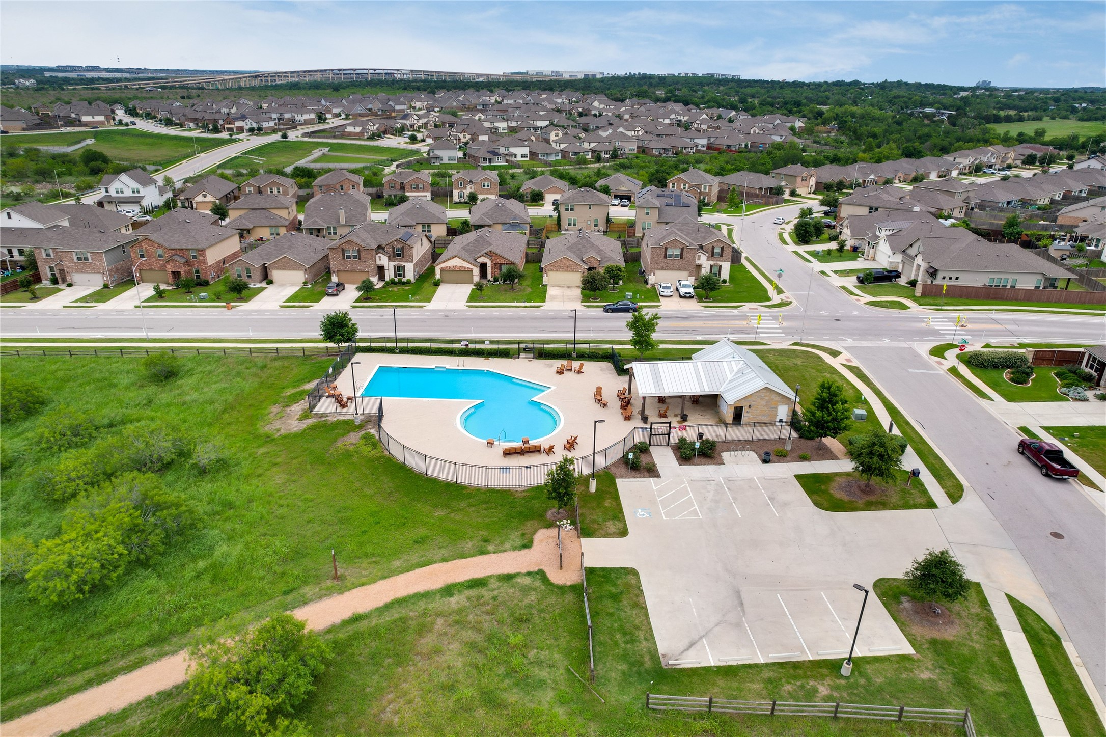7404 Albany Drive Austin, TX 78754 - Photo 37 of 40 You're just a short stroll to the HOA amenity center, which also has ample parking.