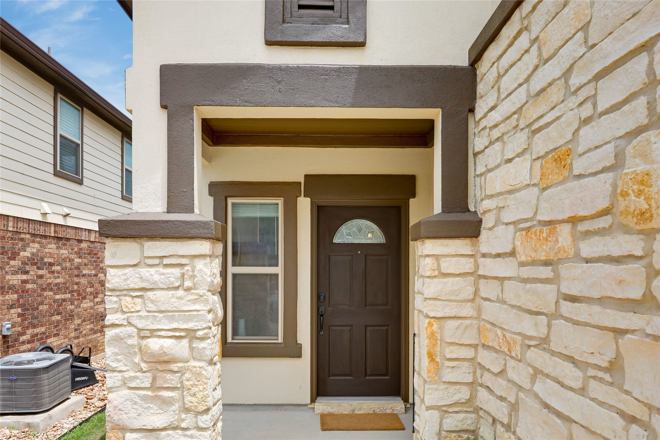 7404 Albany Drive Austin, TX 78754 - Photo 6 of 40 Striking architectural design with stucco and stone masonry, along with craftsman accents.