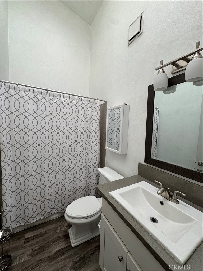 3932 West 5th Street, Unit 202 Santa Ana, CA 92703 - Photo 7 of 12 a bathroom with a sink toilet and shower