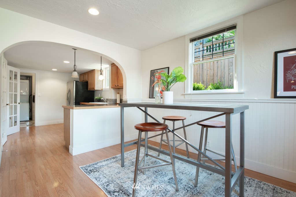 3011 West Viewmont Way West Seattle, WA 98199 - Photo 21 of 28 a view of a dining room with furniture and a wooden floor