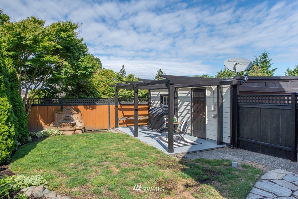 3011 West Viewmont Way West Seattle, WA 98199 - Photo 24 of 28 a view of a backyard with plants and a slide
