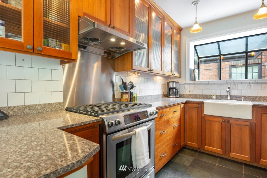3011 West Viewmont Way West Seattle, WA 98199 - Photo 7 of 28 a kitchen with a stove and a sink