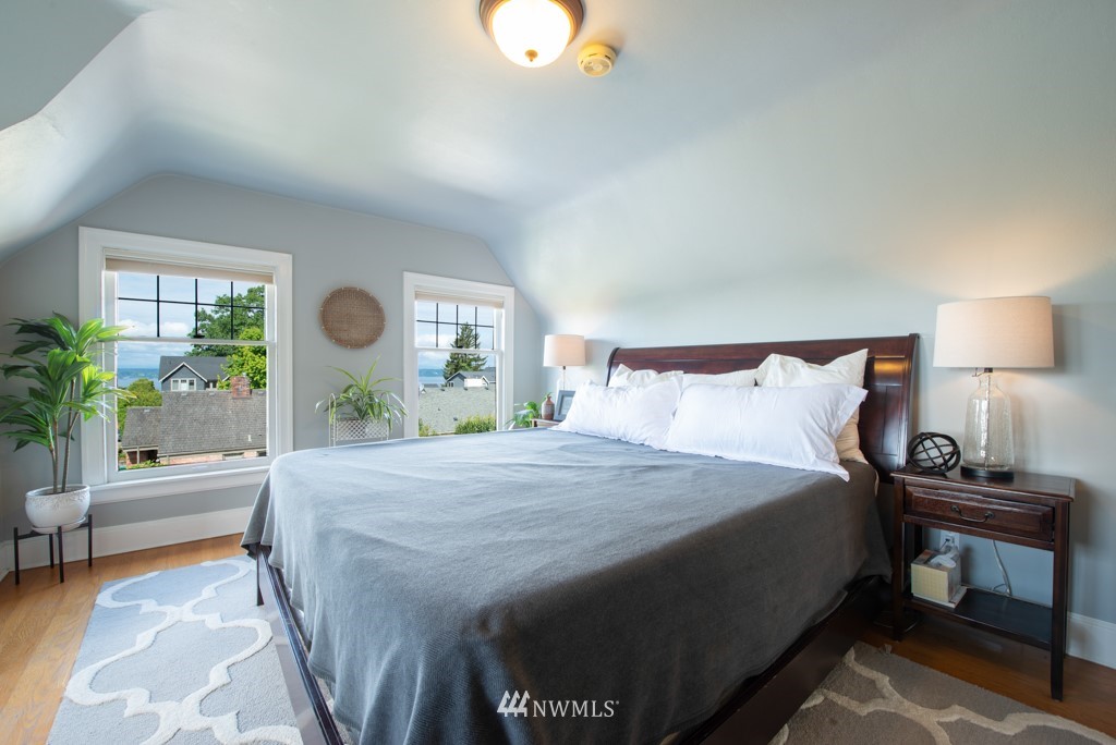 3011 West Viewmont Way West Seattle, WA 98199 - Photo 9 of 28 a bedroom with a bed and a potted plant