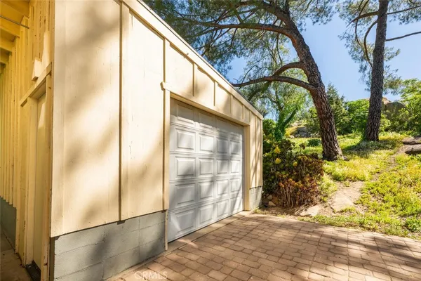an aerial view of a house with yard and outdoor seating