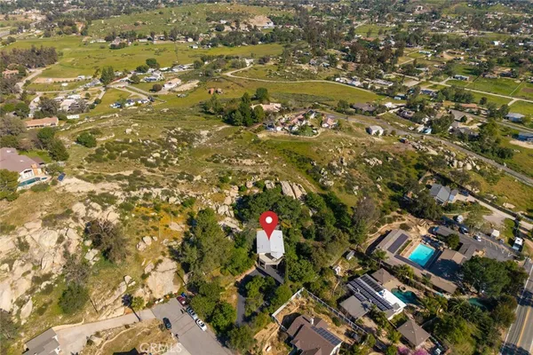 an aerial view of residential houses with yard