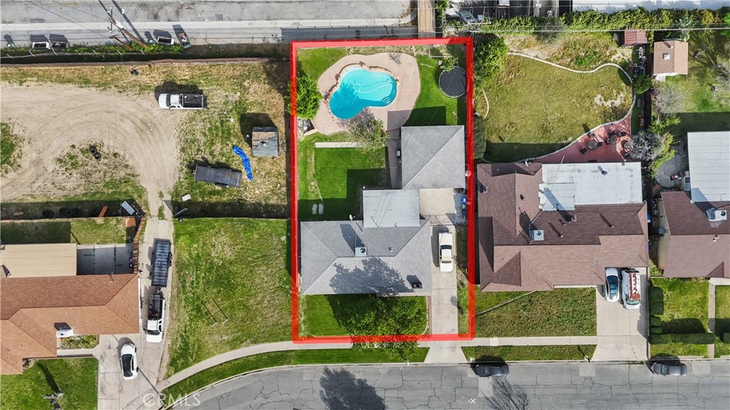 1455 North Alice Avenue Rialto, CA 92376 - Photo 22 of 23 an aerial view of residential houses with outdoor space and swimming pool