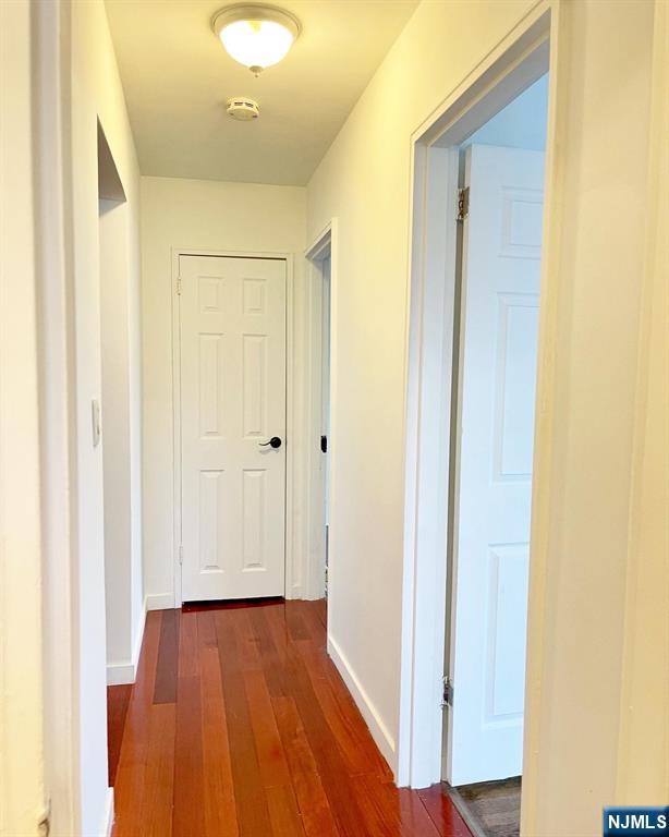 2205 North Central Road, Unit 3D Fort Lee, NJ 07024 - Photo 14 of 29 a view of a hallway with wooden floor