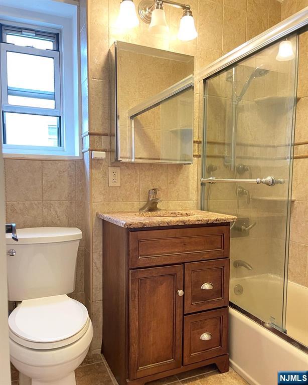 2205 North Central Road, Unit 3D Fort Lee, NJ 07024 - Photo 20 of 29 a bathroom with a granite countertop sink toilet and shower