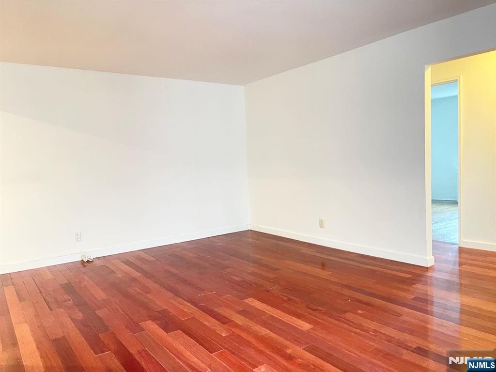 2205 North Central Road, Unit 3D Fort Lee, NJ 07024 - Photo 7 of 29 a view of empty room with wooden floor