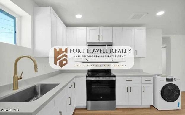 a kitchen with a stove and a sink