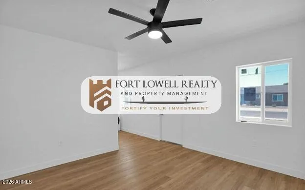 a view of a kitchen with an oven and a wooden floor