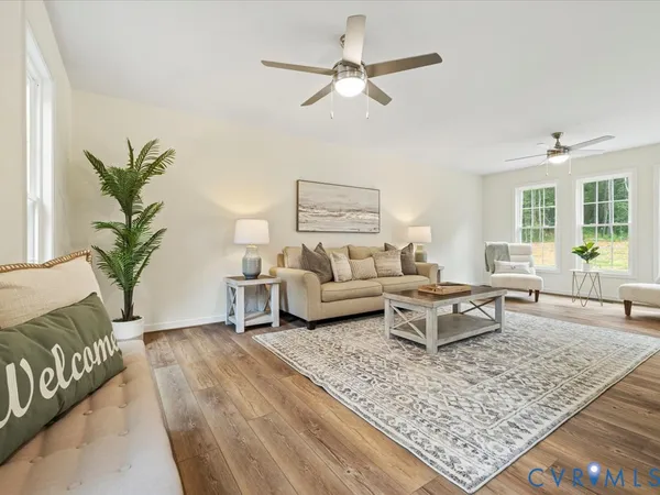 a living room with furniture and a rug