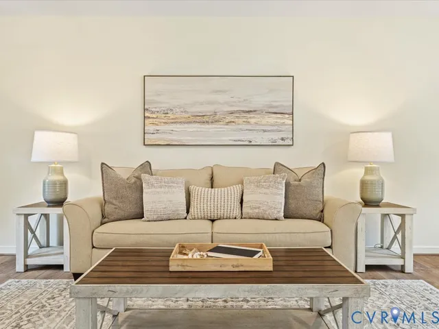 a living room with furniture and a lamp