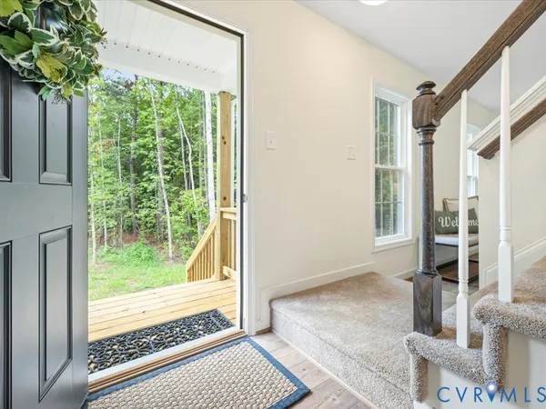 a view of an empty room and glass door