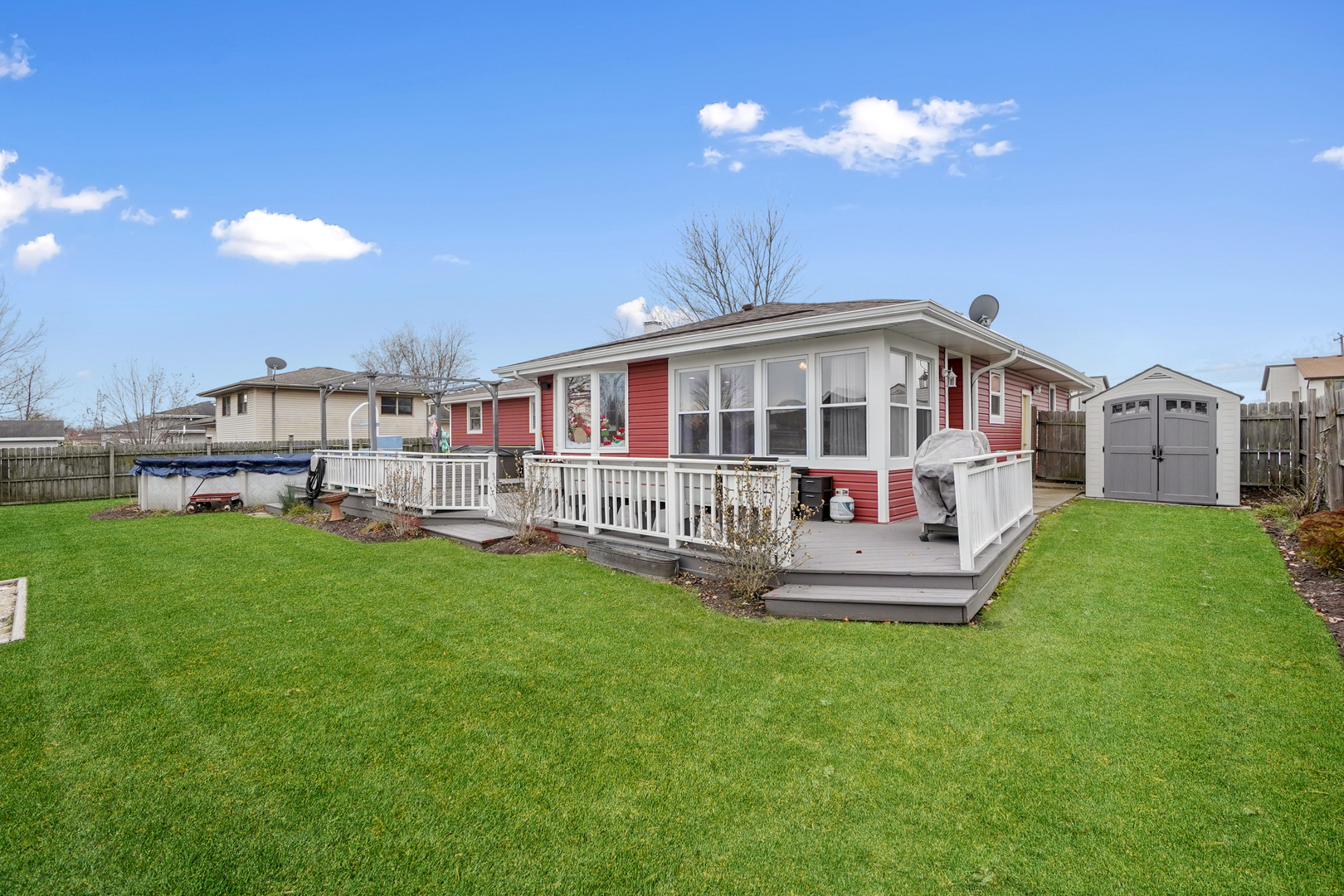1014 Southgate Road New Lenox, IL 60451 - Photo 16 of 18 a front view of a house with a garden and plants