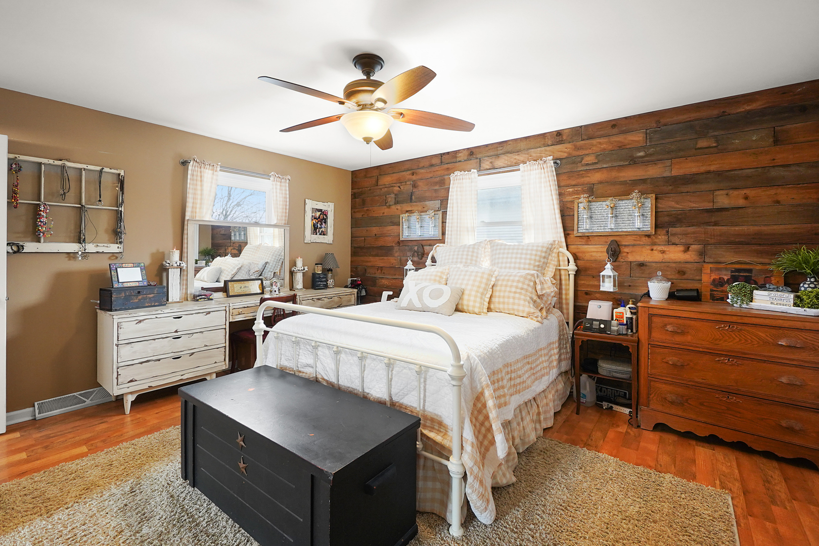 1014 Southgate Road New Lenox, IL 60451 - Photo 7 of 18 a bedroom with a bed and a chandelier