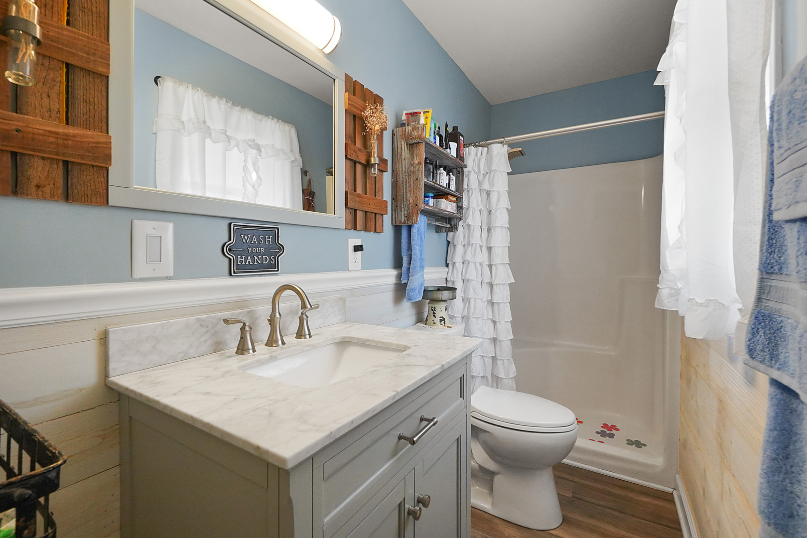 1014 Southgate Road New Lenox, IL 60451 - Photo 8 of 18 a bathroom with a sink toilet and shower