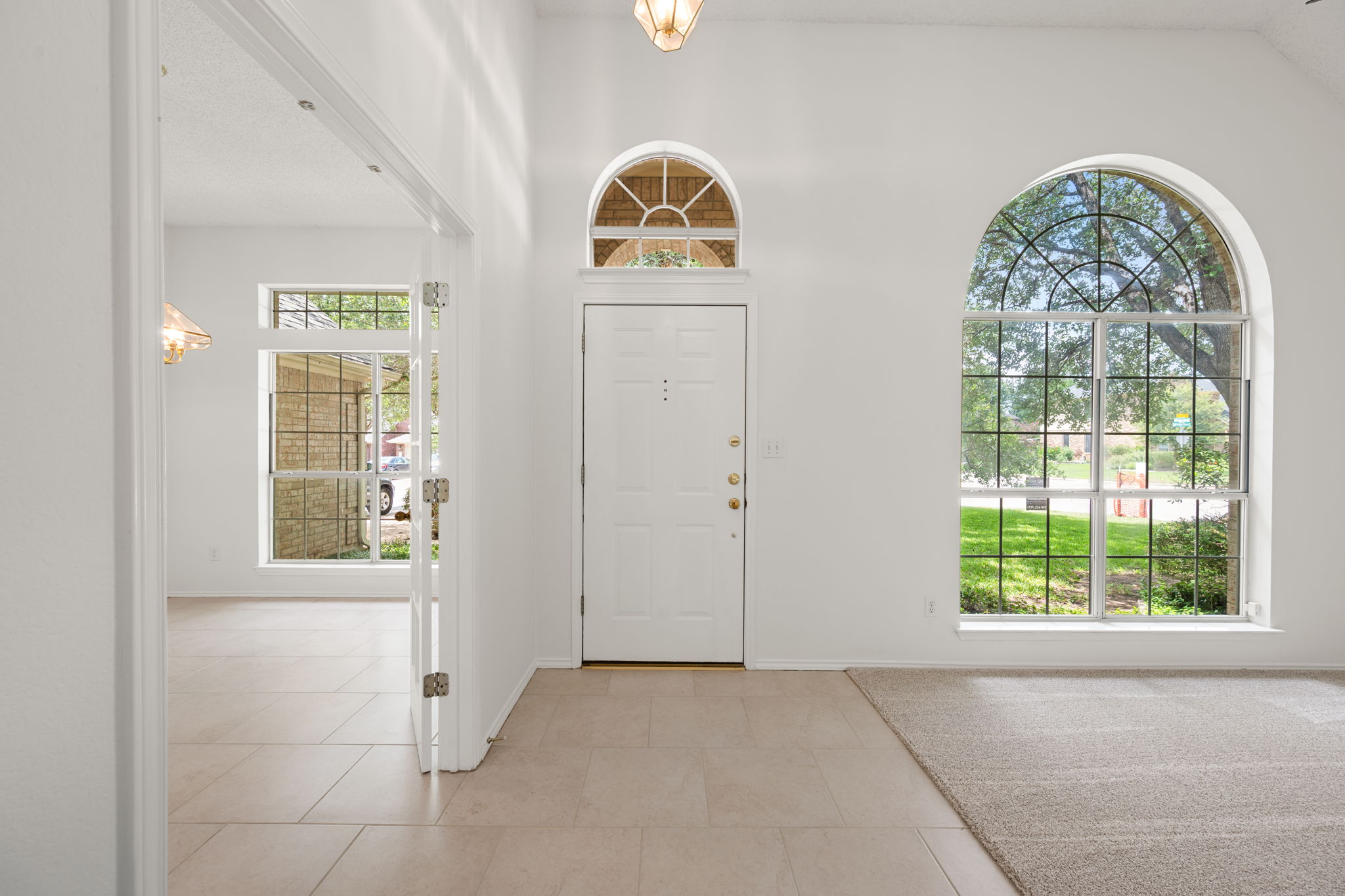 707 Ridge View Drive Leander, TX 78641 - Photo 7 of 40 an empty room with windows and wooden floor