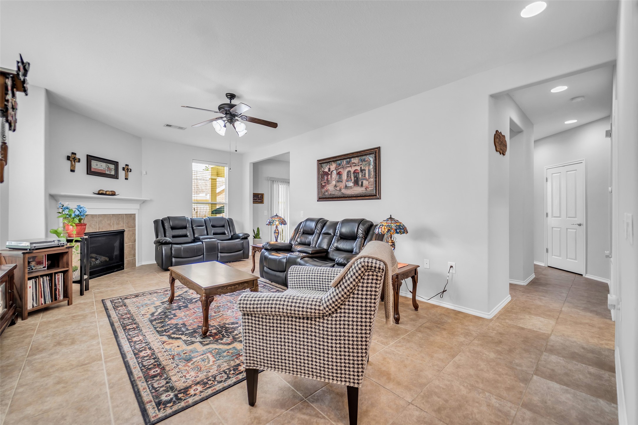 13600 Breton Ridge Street, Unit 20A Houston, TX 77070 - Photo 8 of 25 Beautiful tile flooring, fireplace in living room.