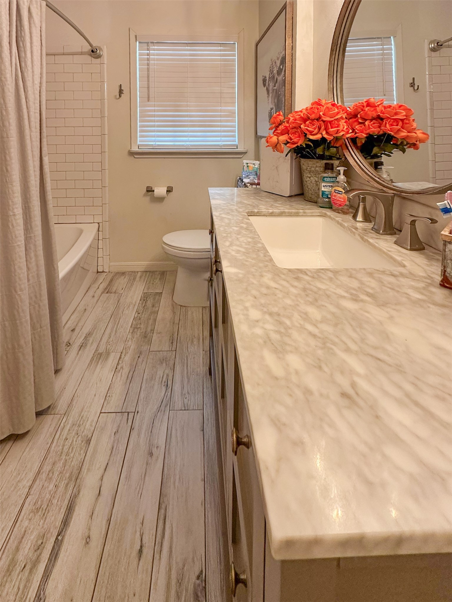720 Northridge Street Angleton, TX 77515 - Photo 11 of 12 a bathroom with a sink and a mirror