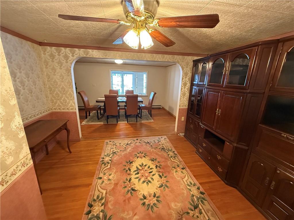 2964 McIntyre Road McIntyre, PA 15756 - Photo 12 of 29 a dining room with wooden floor and chandelier