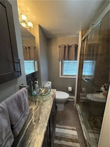 a living room with furniture and a mirror