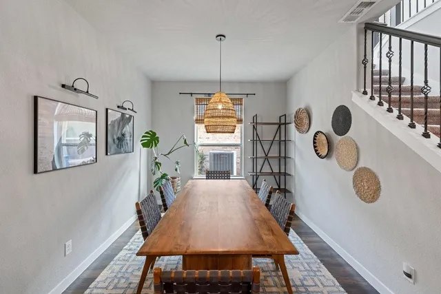 a dining room with window and furniture
