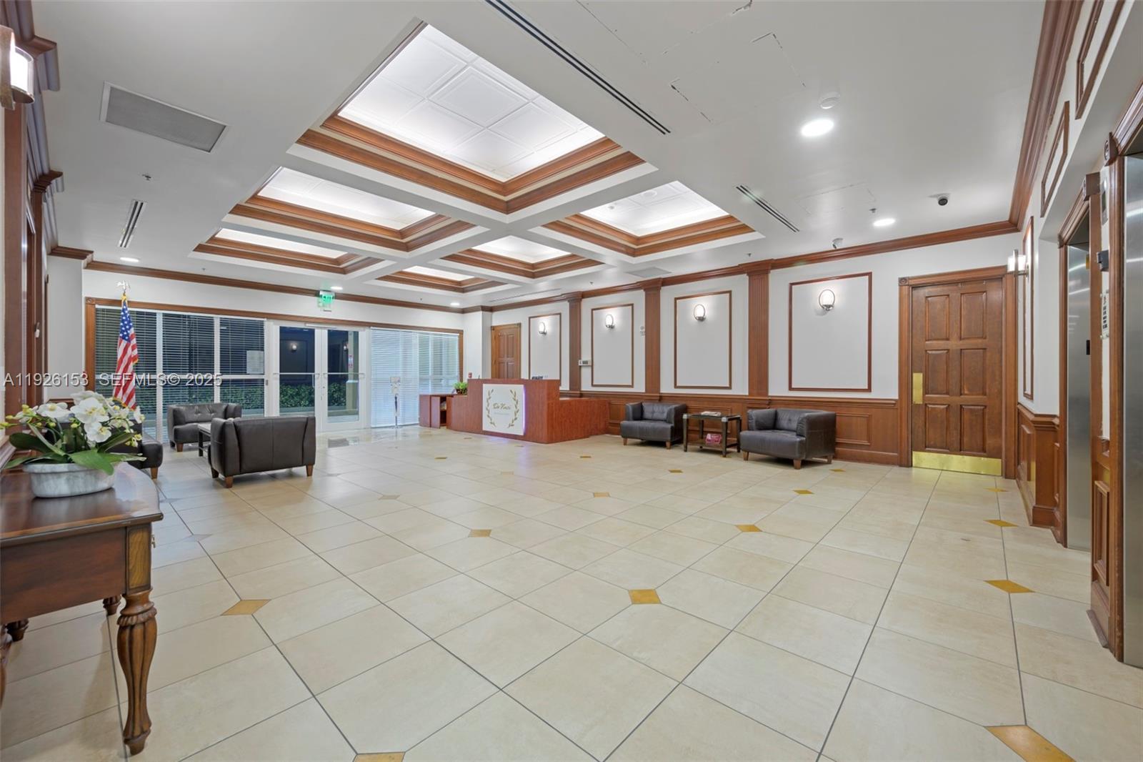 2665 Southwest 37th Avenue, Unit 202 Miami, FL 33133 - Photo 14 of 15 a lobby with furniture and potted plants