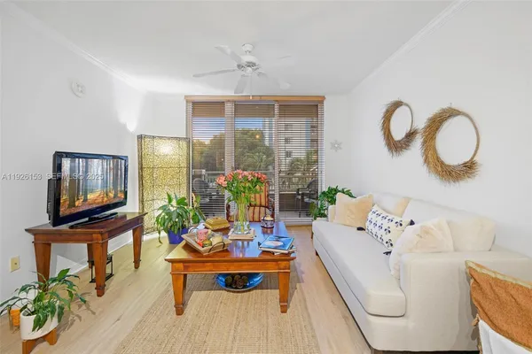 a living room with furniture fireplace and dining table