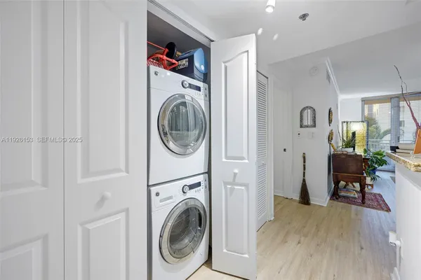 a view of a hallway with washer and dryer