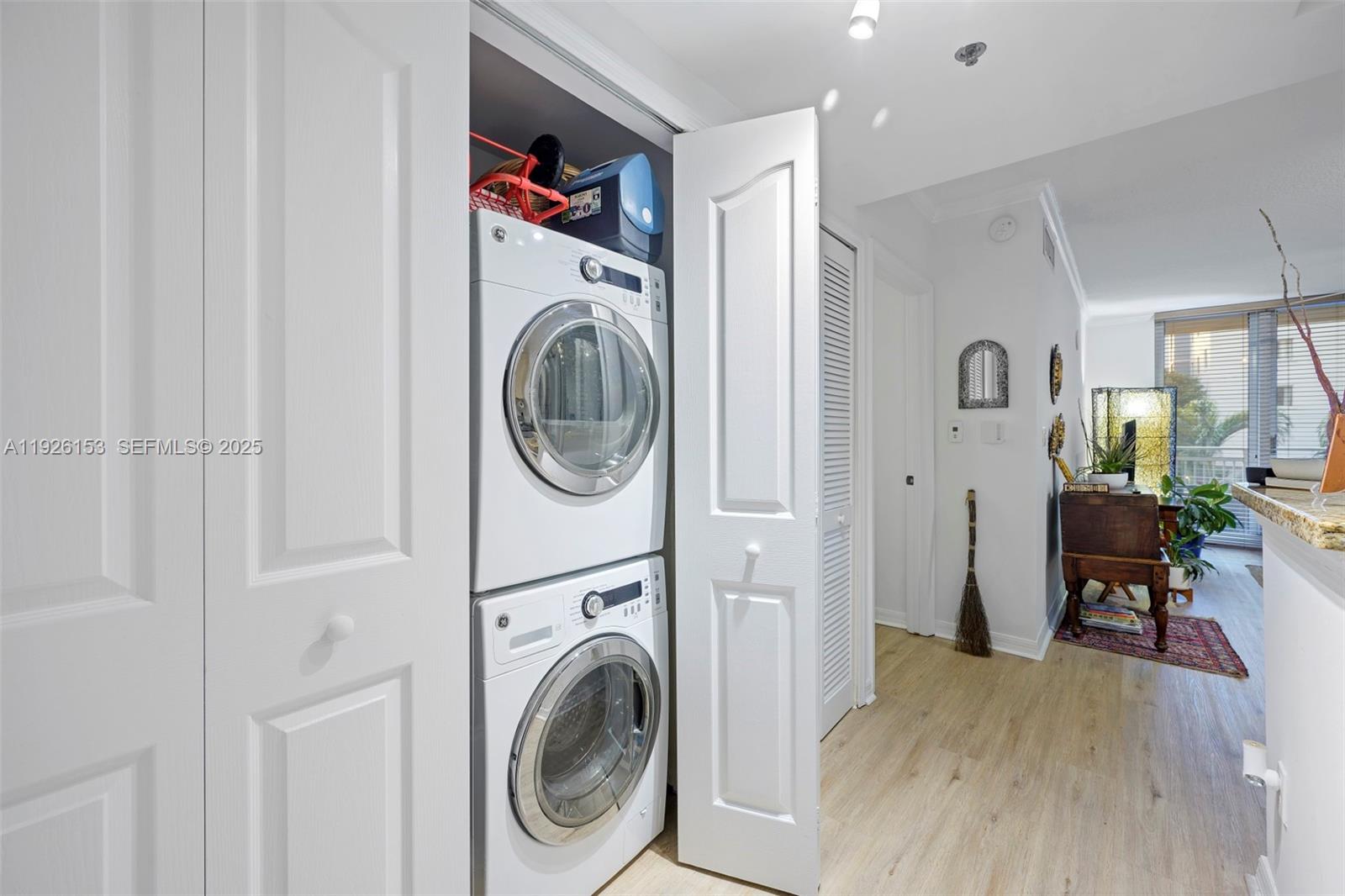 2665 Southwest 37th Avenue, Unit 202 Miami, FL 33133 - Photo 7 of 15 a view of a hallway with washer and dryer