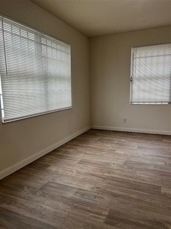 7306 Conley Street Houston, TX 77021 - Photo 2 of 7 a view of an empty room with wooden floor and a window