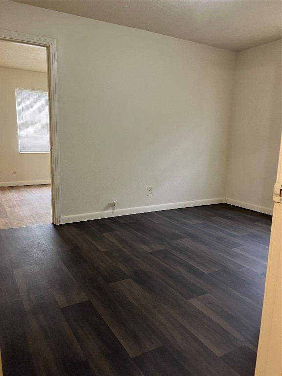 7306 Conley Street Houston, TX 77021 - Photo 6 of 7 an empty room with wooden floor and windows