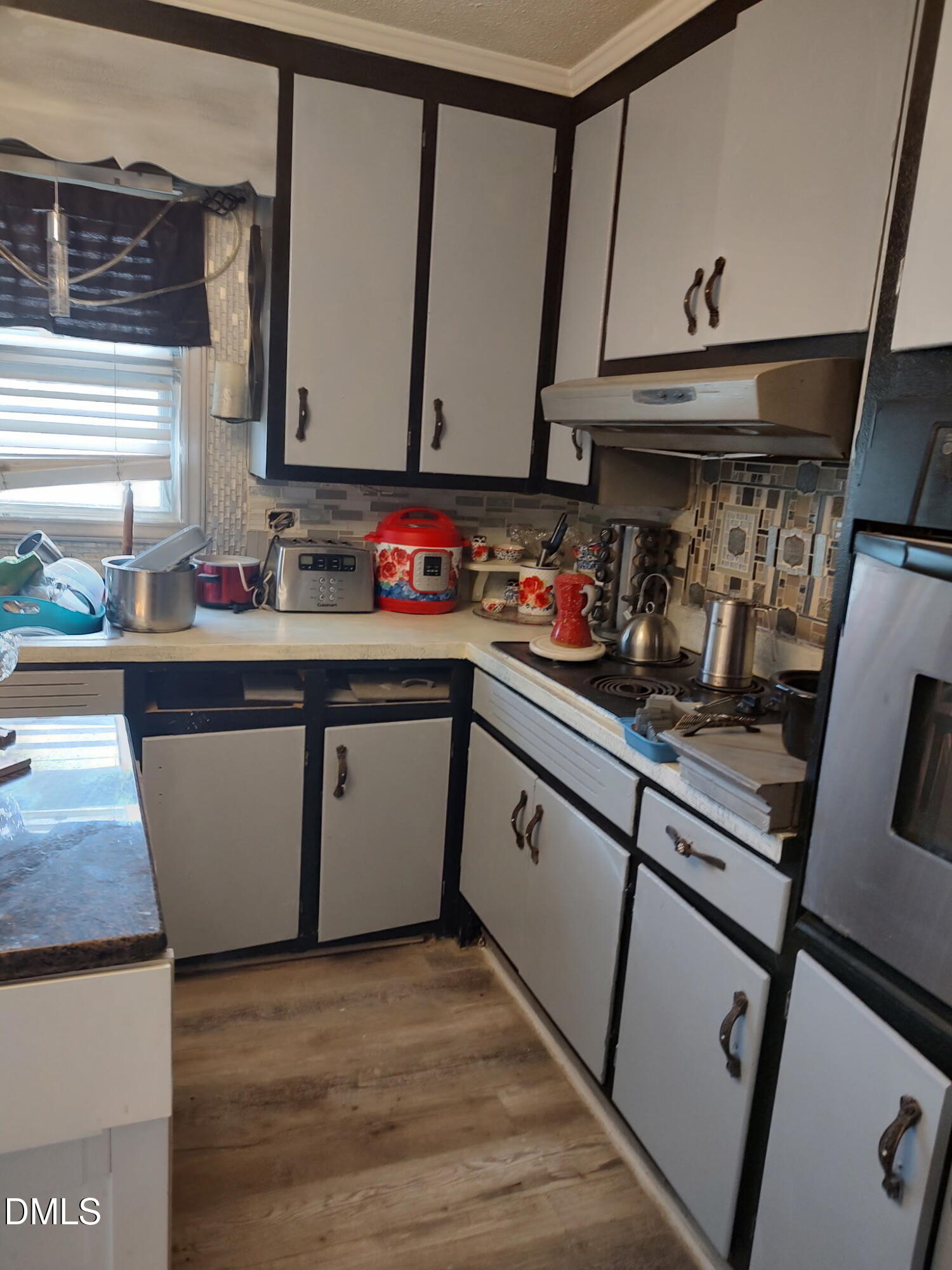 2641 South Nc 87 Graham, NC 27253 - Photo 12 of 17 a kitchen with a sink a stove and cabinets