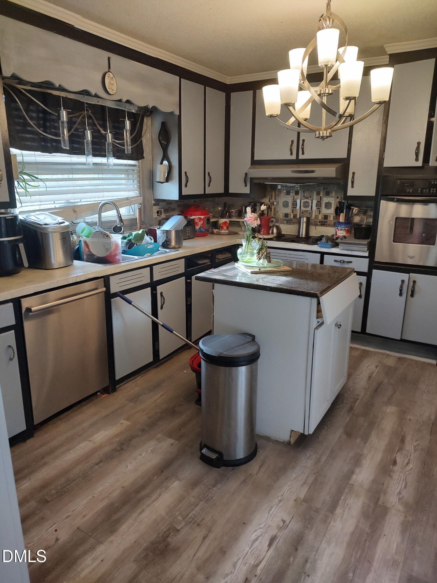 2641 South Nc 87 Graham, NC 27253 - Photo 13 of 17 a kitchen with a sink cabinets and wooden floor