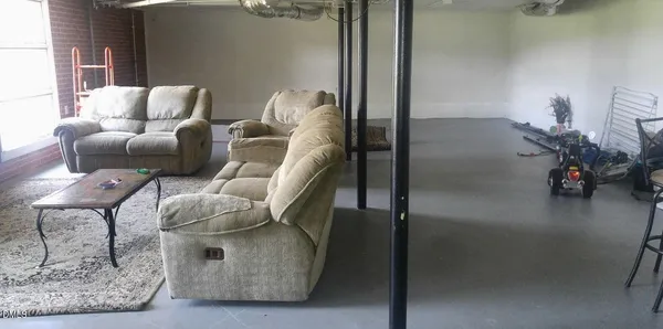 a kitchen with a sink cabinets and window
