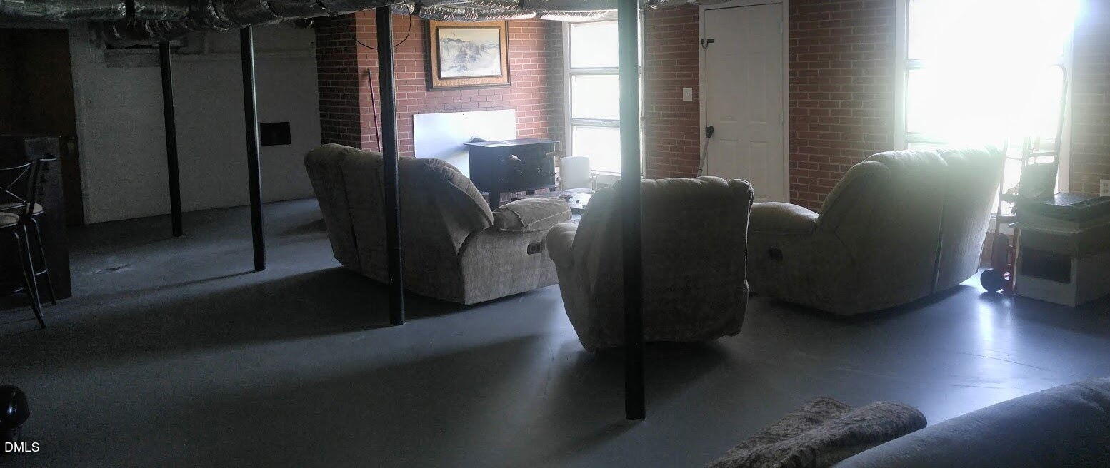 2641 South Nc 87 Graham, NC 27253 - Photo 15 of 17 a living room with furniture and a window