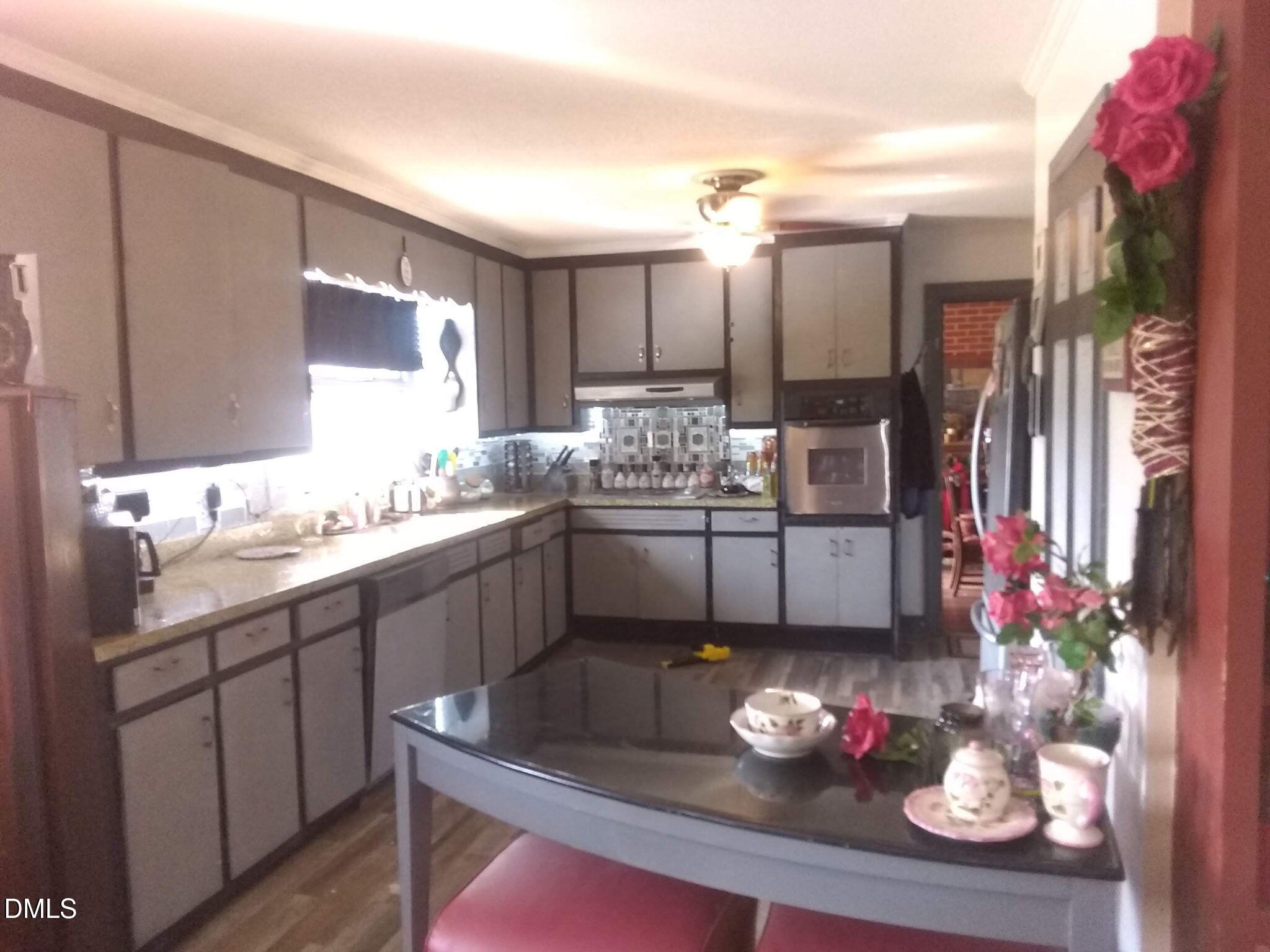 2641 South Nc 87 Graham, NC 27253 - Photo 16 of 17 a kitchen with a sink cabinets and window
