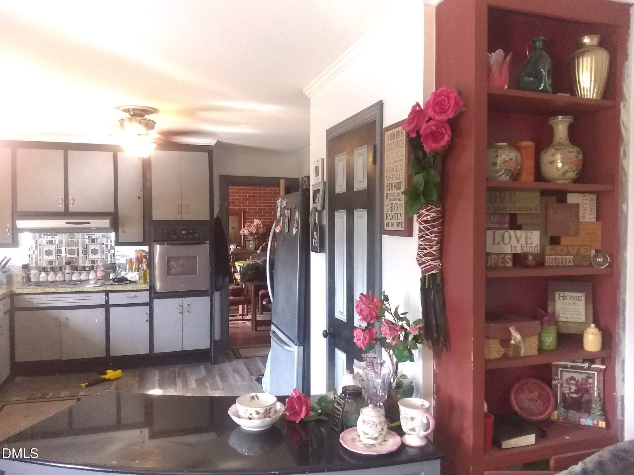 2641 South Nc 87 Graham, NC 27253 - Photo 17 of 17 a kitchen with refrigerator and stove