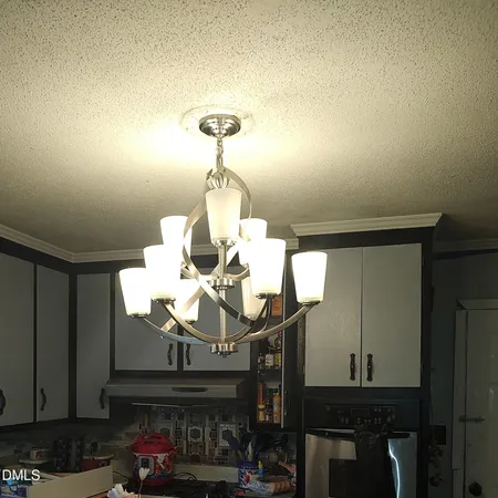 a kitchen with a sink a stove and cabinets
