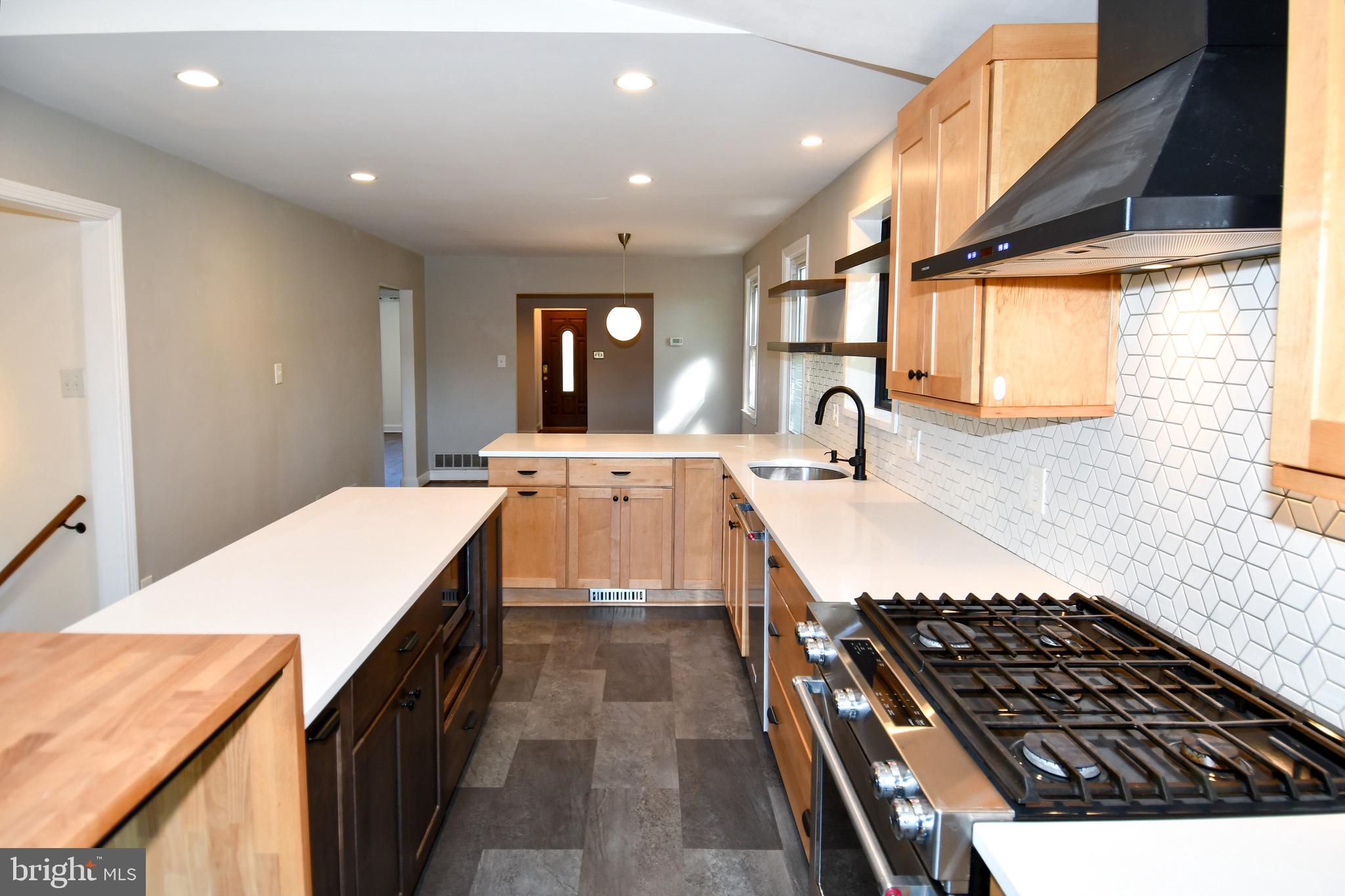 2100 South Quebec Street Arlington, VA 22204 - Photo 15 of 36 a kitchen with a sink stove and cabinets
