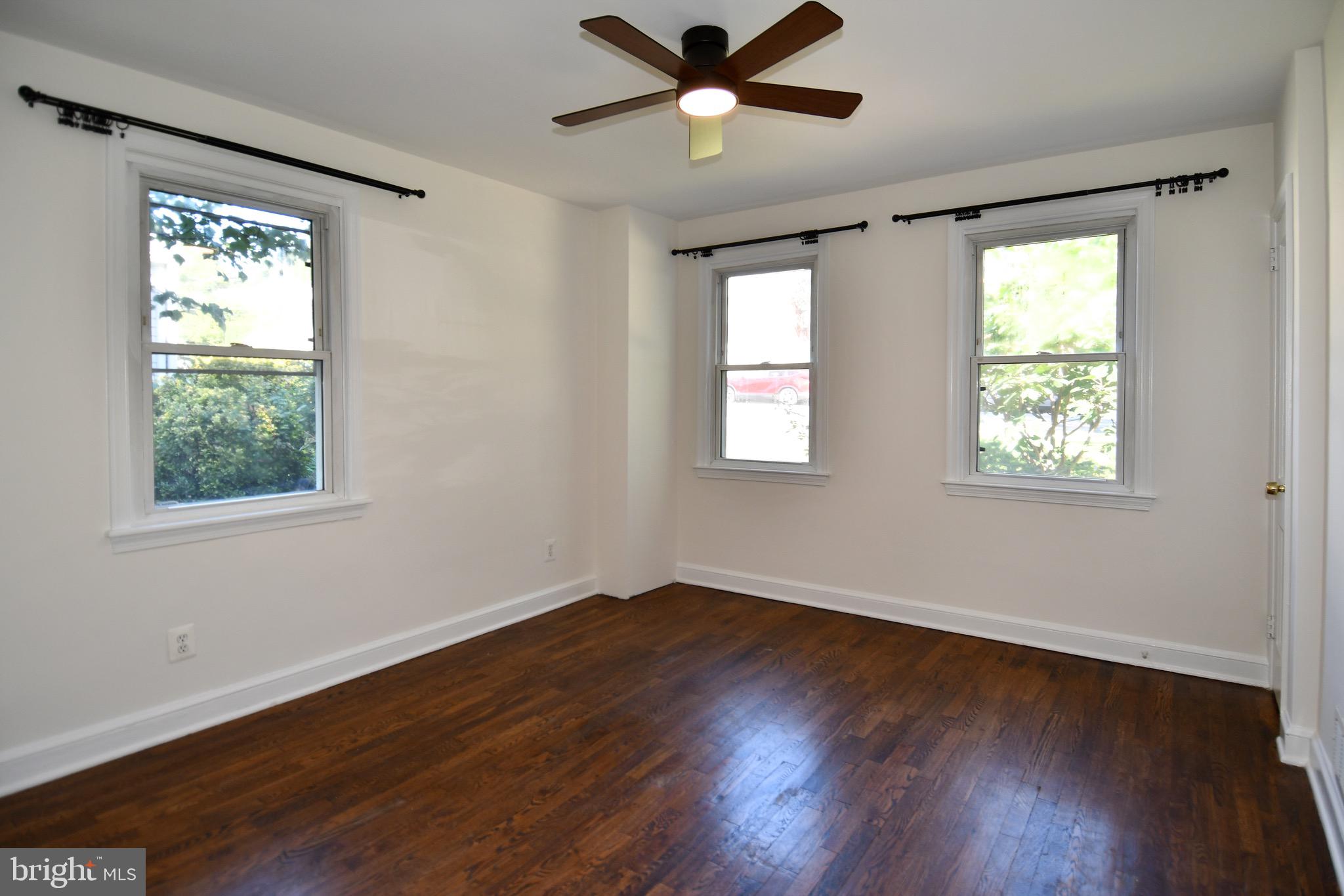 2100 South Quebec Street Arlington, VA 22204 - Photo 20 of 36 a view of an empty room with wooden floor and a window