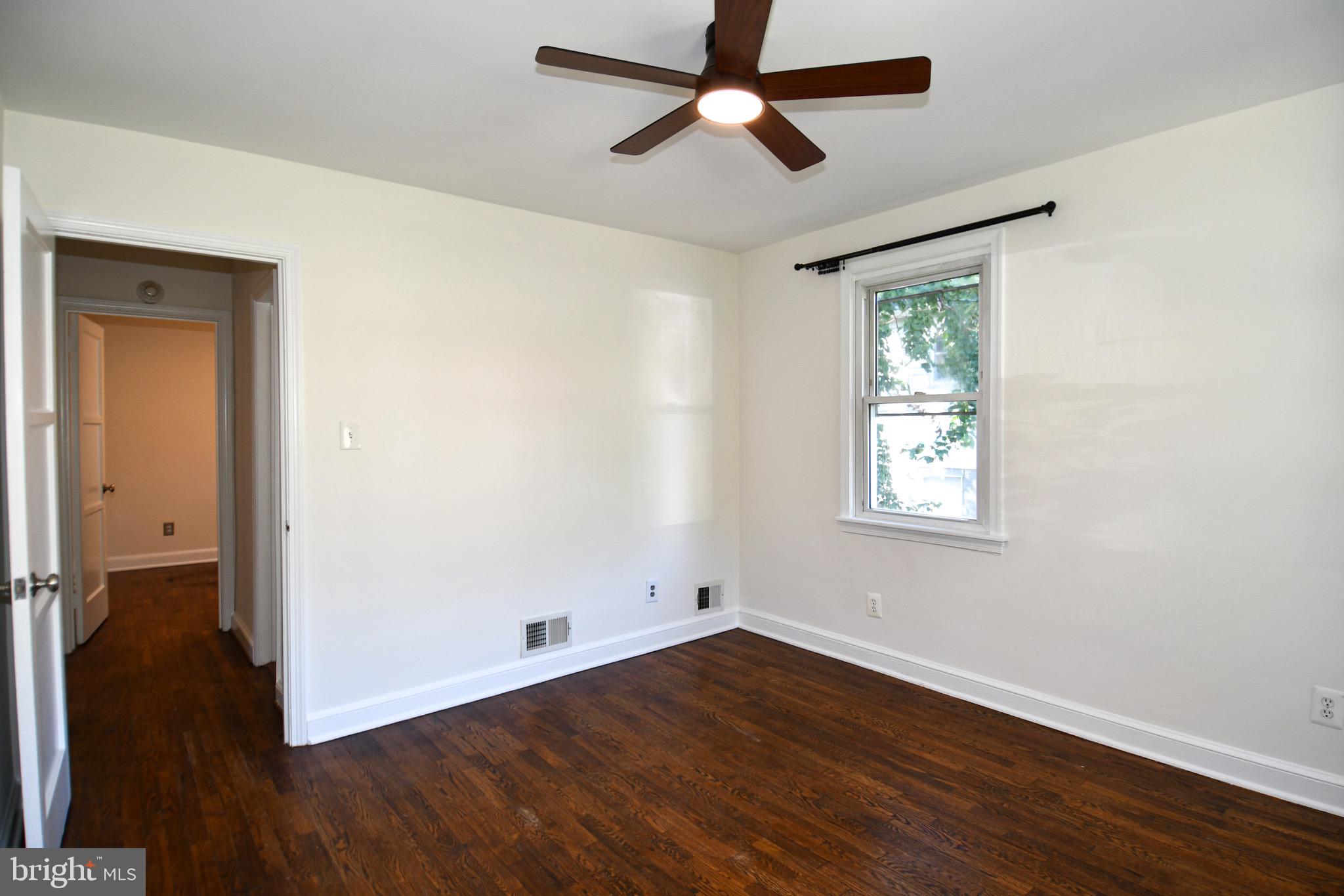 2100 South Quebec Street Arlington, VA 22204 - Photo 21 of 36 a view of empty room with wooden floor and fan