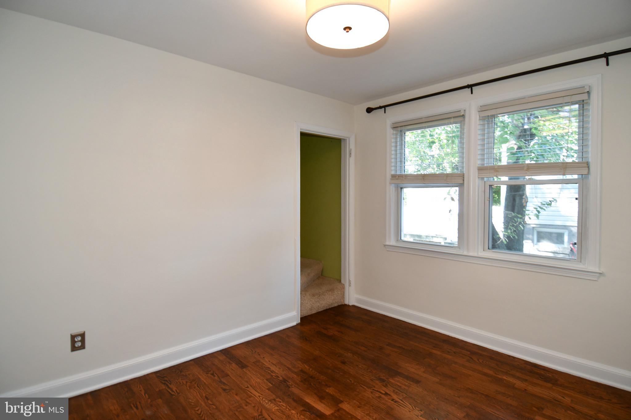 2100 South Quebec Street Arlington, VA 22204 - Photo 24 of 36 an empty room with wooden floor and windows