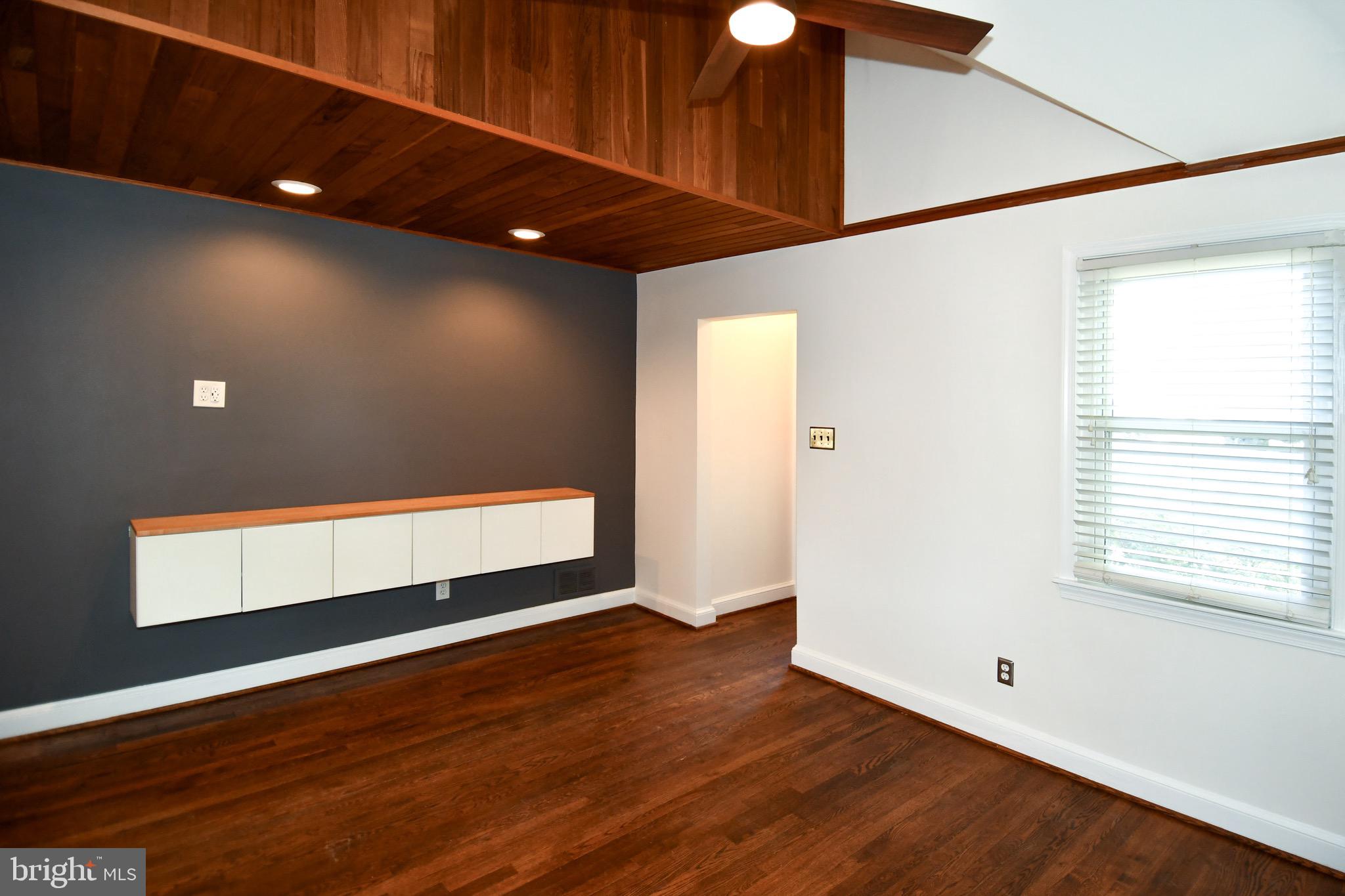 2100 South Quebec Street Arlington, VA 22204 - Photo 4 of 36 a view of room with window and wooden floor